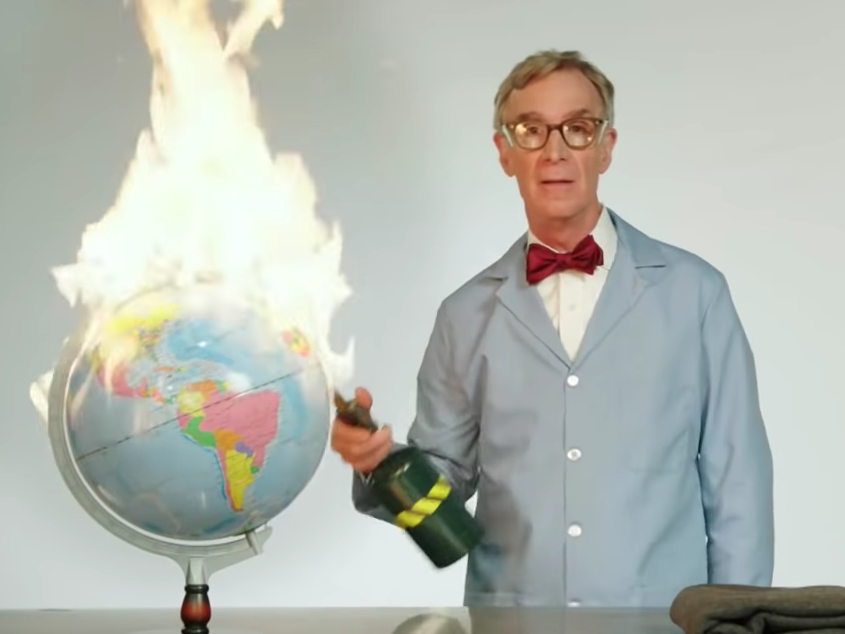 Bill Nye lighting a globe on fire
